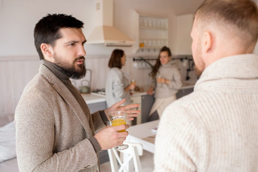 a person holding a glass of beer