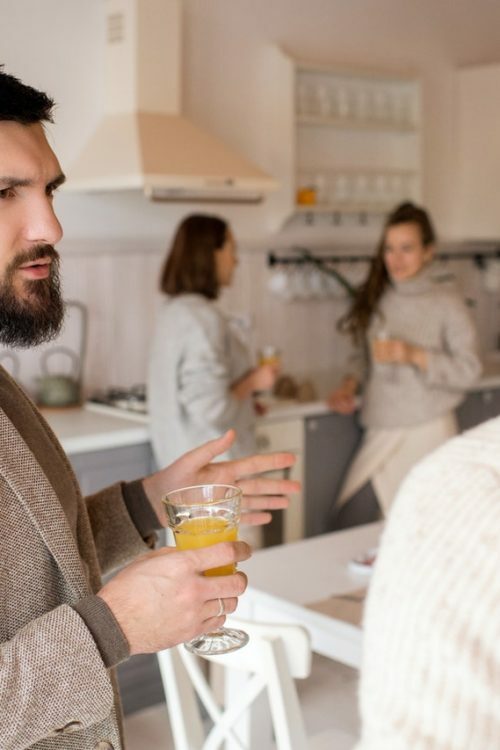 a person holding a glass of beer