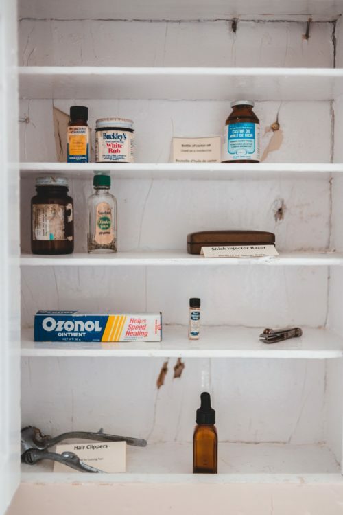 a shelf with bottles and other items