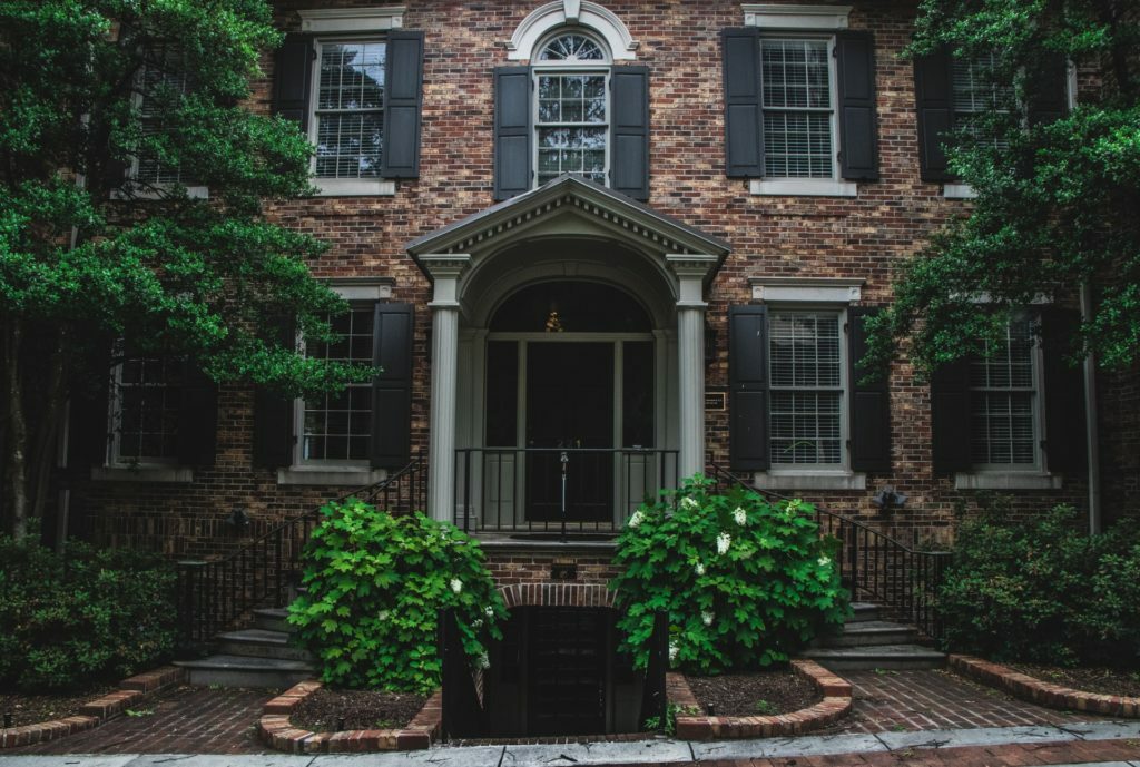 a brick building with a gate and a gate in front of it