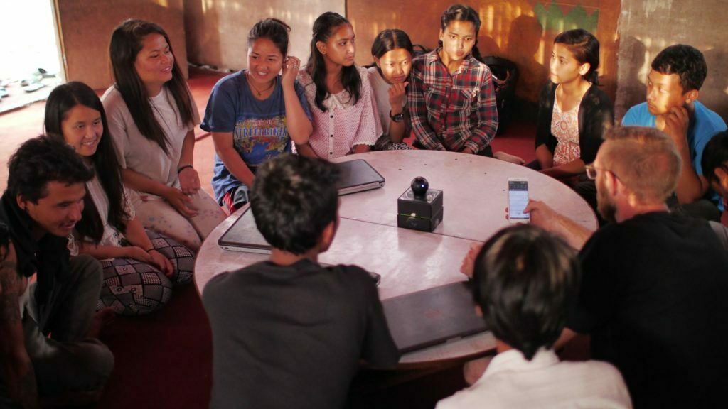 a group of people sitting at a table