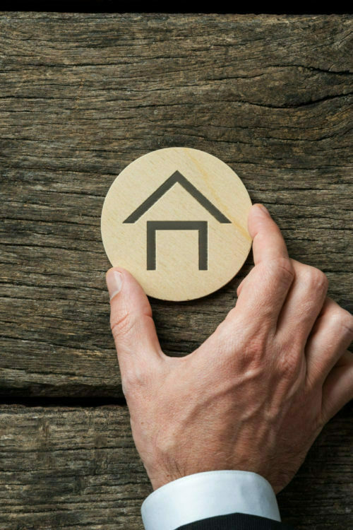 a person holding a gold coin