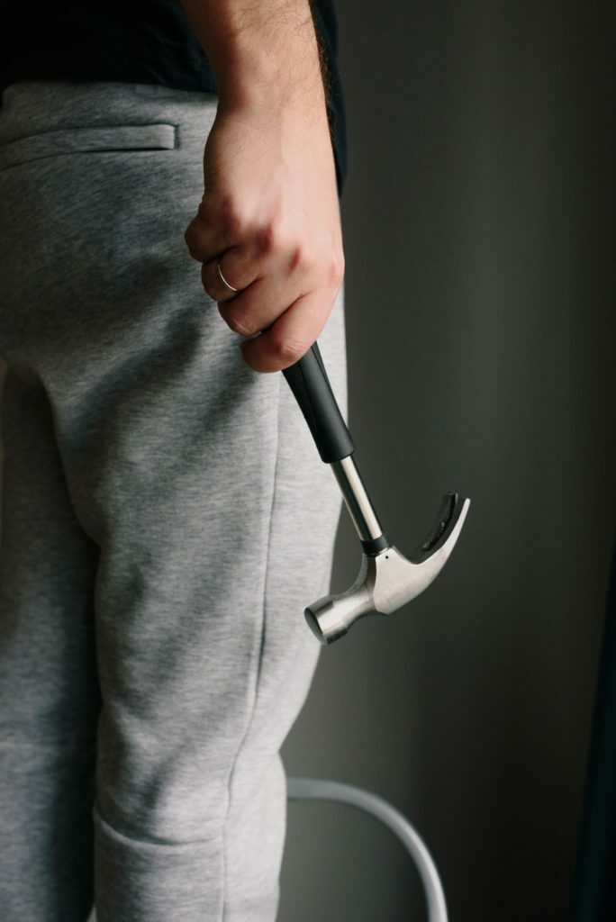 a person holding a black object