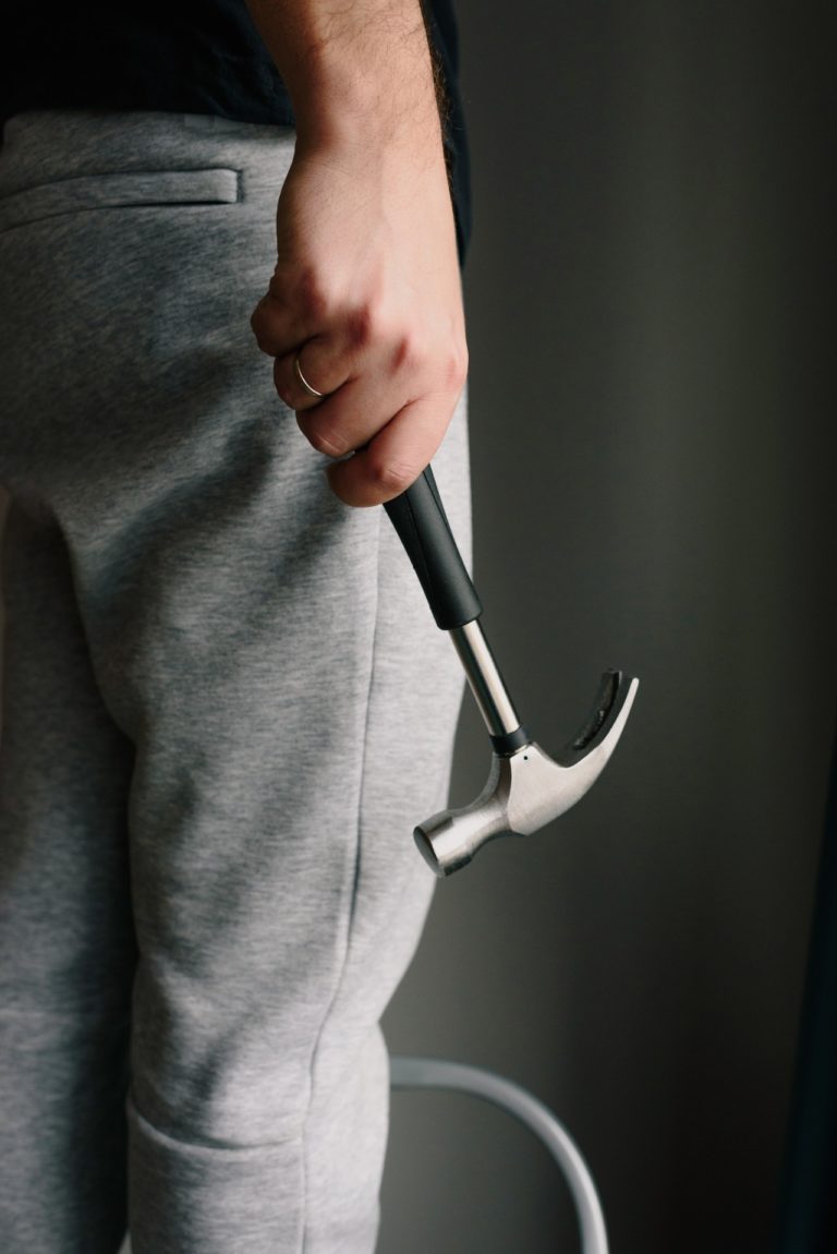 a person holding a black object